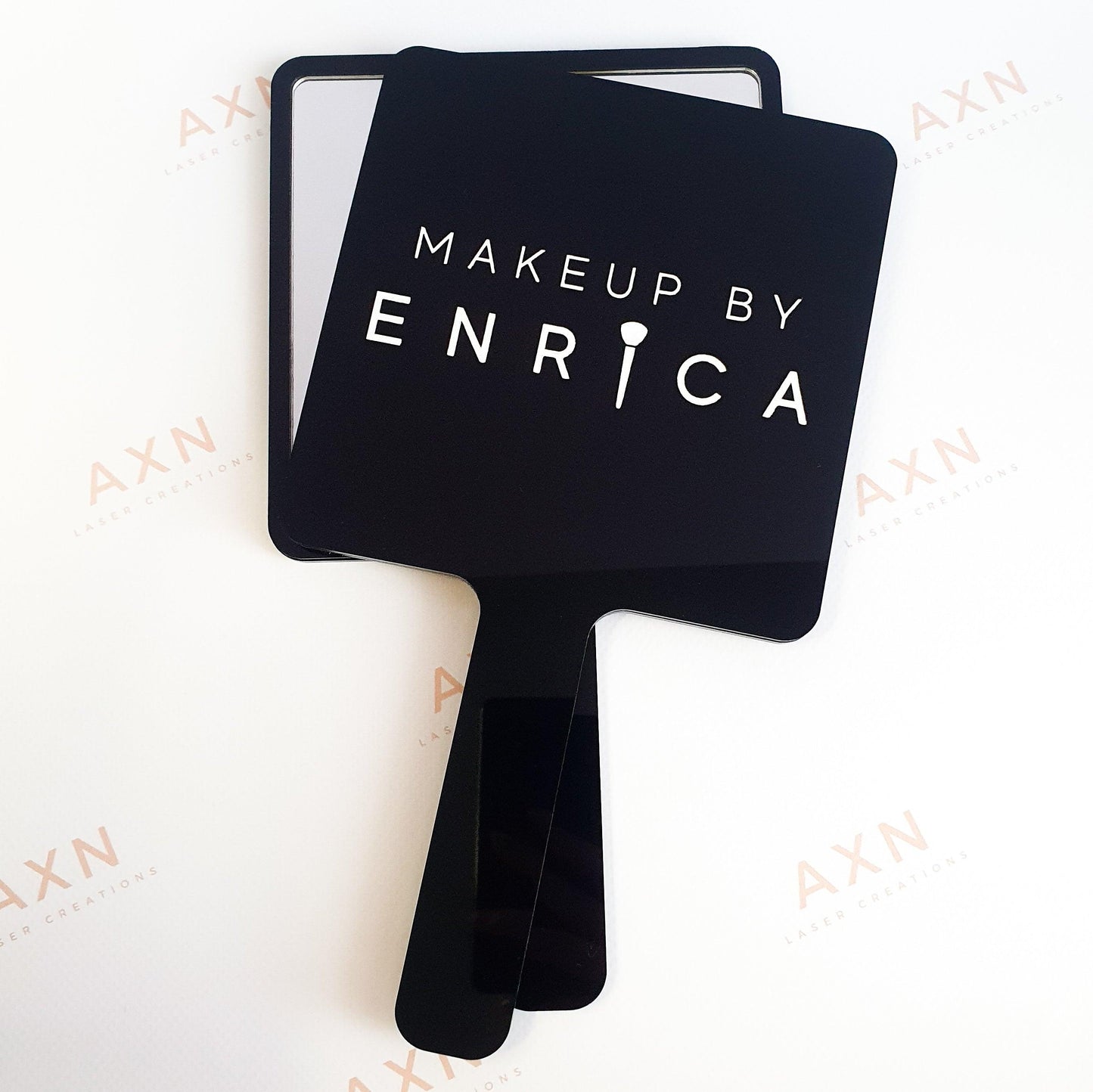 Handheld mirror with engraving and logo