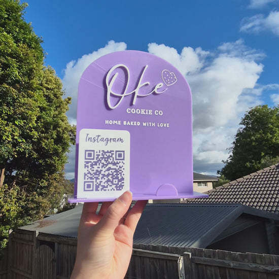 Video of an acrylic sign used for holding business cards and showing off logo