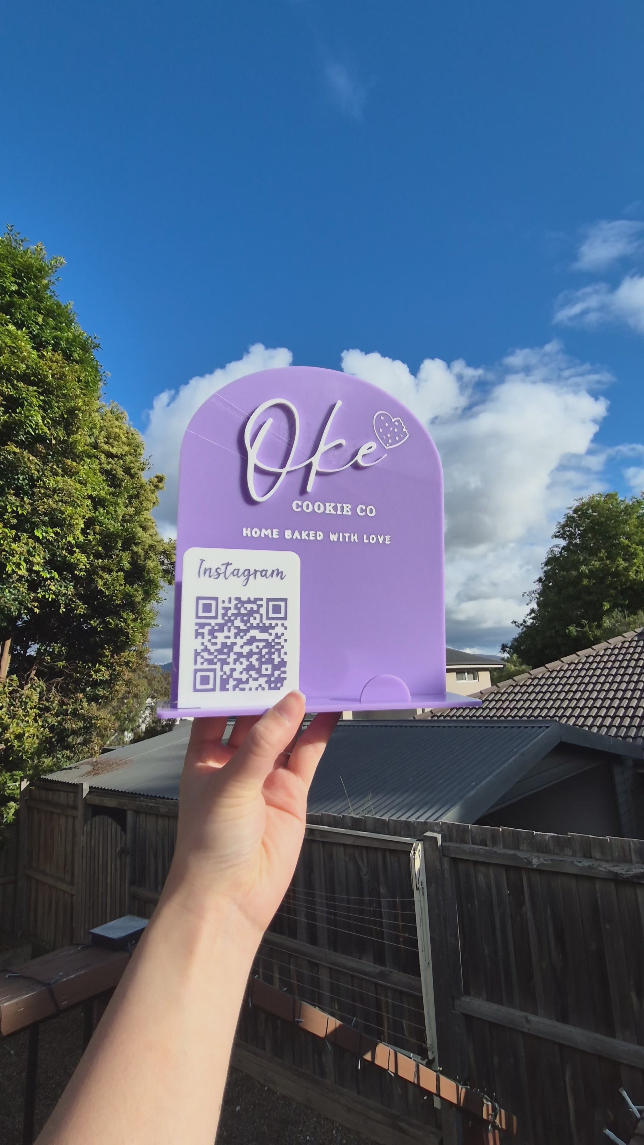 Video of an acrylic sign used for holding business cards and showing off logo